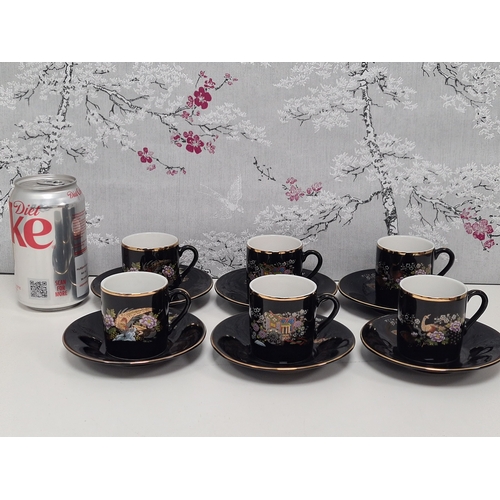 513 - Japanese black floral painted coffee set to include 6 cups with saucers. One cup AF