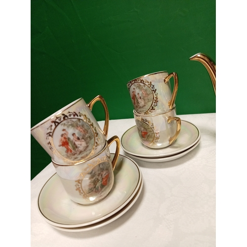 516 - Ornate foreign porcelain coffee service, this consists of six cups, saucers, coffee pot, sugar bowl ... 