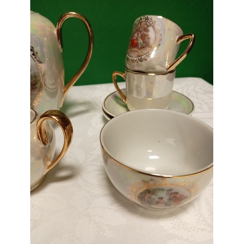 516 - Ornate foreign porcelain coffee service, this consists of six cups, saucers, coffee pot, sugar bowl ... 