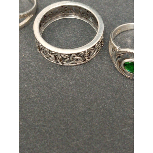 720 - Four 925 silver rings includes two thistle rings one with clear stone, one with green stone and two ... 