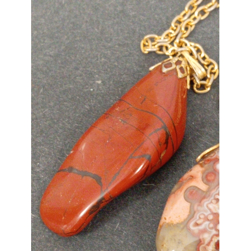 744 - Four vintage Agate stone pendants on chains.