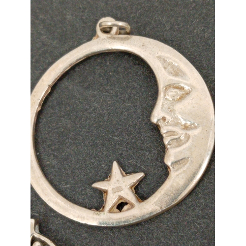 745 - Three 925 silver pendants includes Rennie Macintosh style pendant, crescent moon pendant and a celti... 