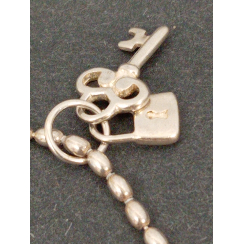 747 - 925 silver ball link bracelet 18cm with lock and key charm and spoon charm.