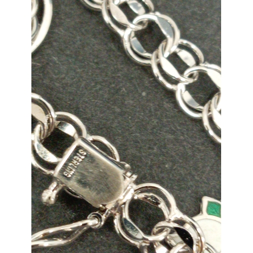 749 - 925 silver link charm bracelet with two 925 silver charms.