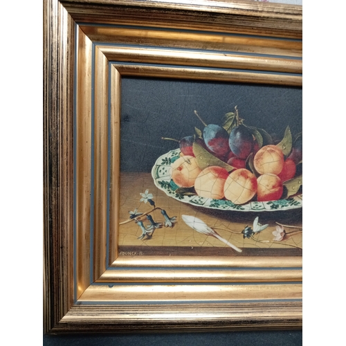 504 - Still life on board nectarines and plums on a blue and white plate in a gold frame. H 22cm x W 26cm.