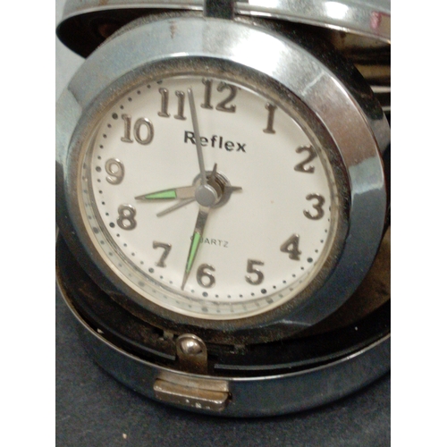 457 - Vintage Elite alarm clock 8cm diameter and a Reflex travel alarm clock 7cm diameter.