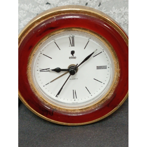 457 - Vintage Elite alarm clock 8cm diameter and a Reflex travel alarm clock 7cm diameter.