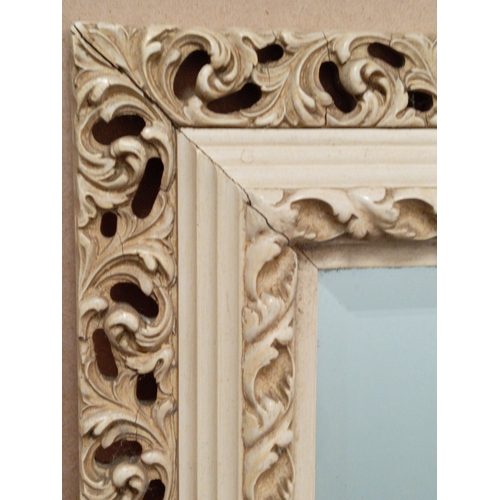 476 - Vintage cream wooden framed mirror with bevelled edge H 83cm x W 55cm.