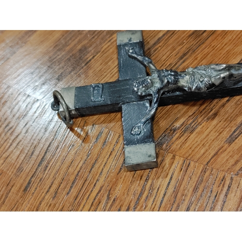 656 - A trio of wood/metal crucifixes. One is believed to be silver.