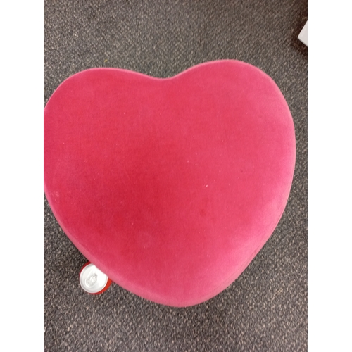 491 - Small pink heart shaped footstool H 29cm x W 39cm.