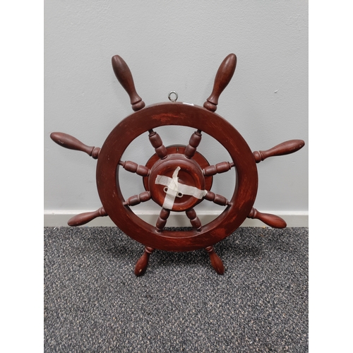 495 - German Hermle ships wheel clock. Has an alarm and winder. H 57cm x W 57cm