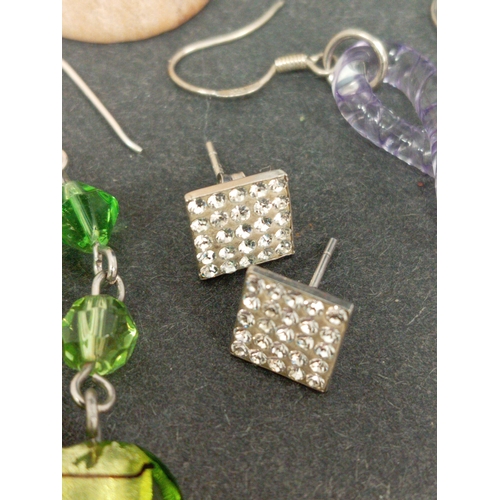 679 - Four pairs of 925 silver earrings includes two dangle glass pairs, diamanté square studs and a pair ... 