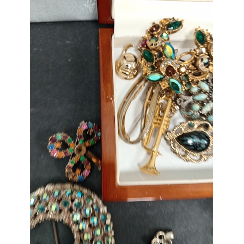 683 - Box of costume jewellery to include pendants, brooches, necklace, tie pins,etc.