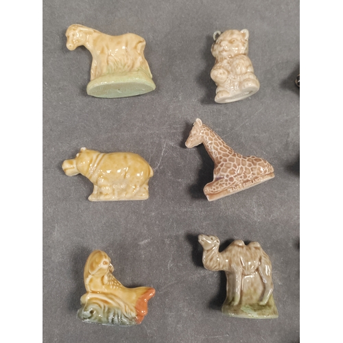 592 - A collection of 12 small wade animal figures, this consists of a hippo, giraffe, camel, fish, dogs a... 