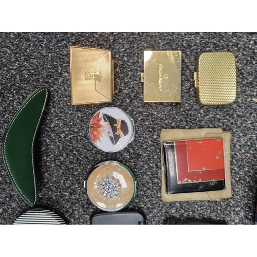 561 - A job lot of 12 compacts, some mirrors, a perfume bottle and a brush. Brands include Stratton, Etien... 