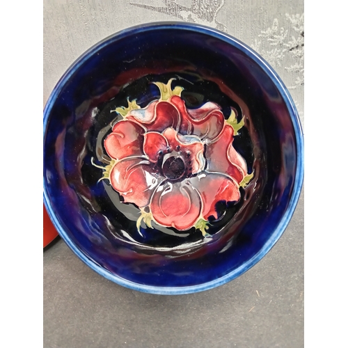 565 - Early 20th century Moorcroft pink anemone on cobalt blue ground bowl. H 5.5cm x W 11cm.