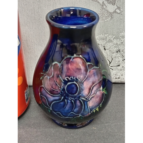 566 - Early 20th century Moorcroft pink anemone on cobalt blue ground vase. H 10cm x W 7cm.