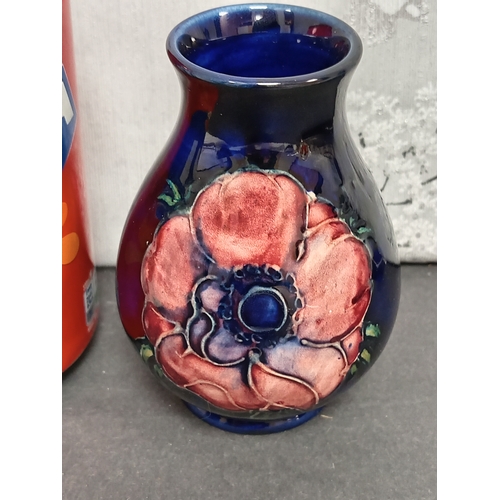 566 - Early 20th century Moorcroft pink anemone on cobalt blue ground vase. H 10cm x W 7cm.