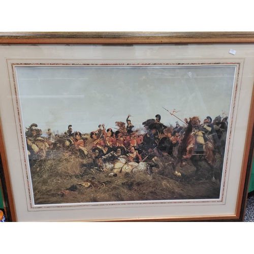 545 - A large framed print depicting a scene from World war 1. H 78cm x 100cm.