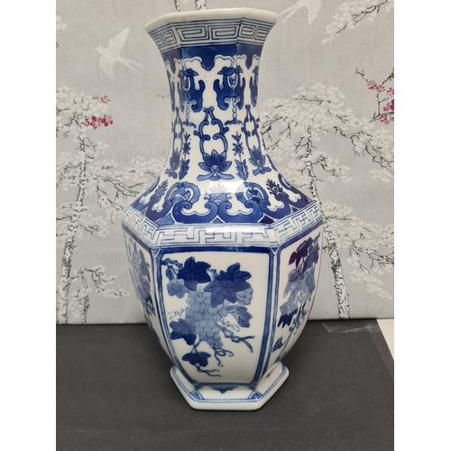 597 - Large Blue & White South Asian style hexagonal vase with floral motifs. Measures H36cm x 17cm diamet... 