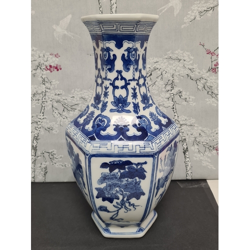 597 - Large Blue & White South Asian style hexagonal vase with floral motifs. Measures H36cm x 17cm diamet... 