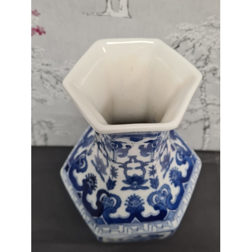 597 - Large Blue & White South Asian style hexagonal vase with floral motifs. Measures H36cm x 17cm diamet... 