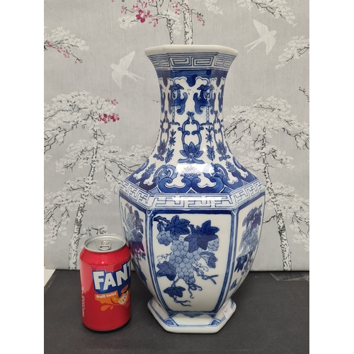 597 - Large Blue & White South Asian style hexagonal vase with floral motifs. Measures H36cm x 17cm diamet... 