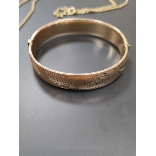 704 - A 9ct rolled gold bangle and a rolled gold necklace with pendant. Weight 33.32g