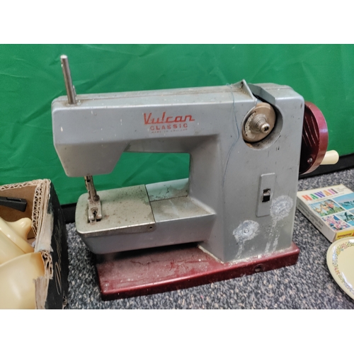 649 - A job lot of mid century toys; including a Vulcan classic sewing machine, tin plates/saucers, play c... 