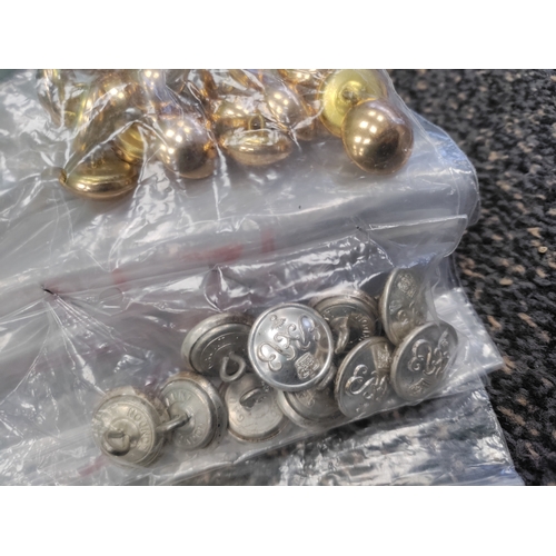 666 - A job lot of 10 bags of military buttons. Brands include Gaunt, Buttons Ltd B'ham and Badge London.