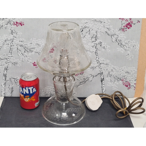 406 - Clear glass lamp & shade with engraved floral & leaf detailing. measures H30cm x17cm widest diamter.