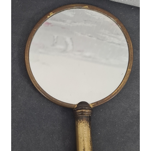 409 - Vintage Ladies handheld vanity mirror and a magnifying glass with ornate designed handle.