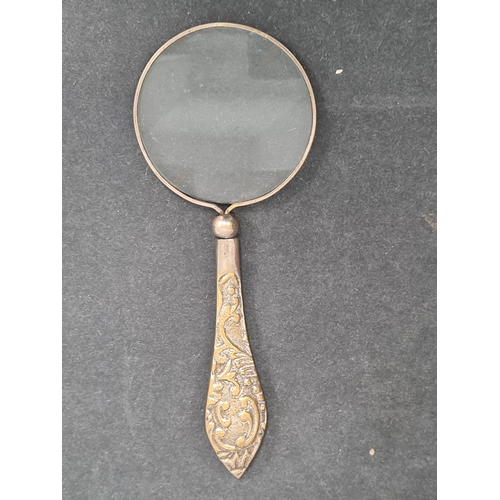 409 - Vintage Ladies handheld vanity mirror and a magnifying glass with ornate designed handle.