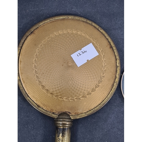 409 - Vintage Ladies handheld vanity mirror and a magnifying glass with ornate designed handle.