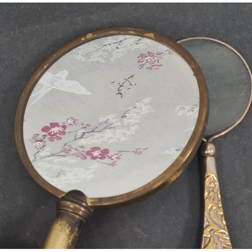 409 - Vintage Ladies handheld vanity mirror and a magnifying glass with ornate designed handle.