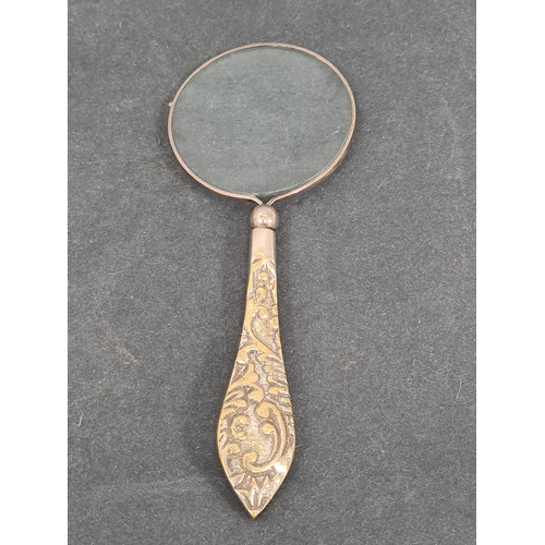 409 - Vintage Ladies handheld vanity mirror and a magnifying glass with ornate designed handle.