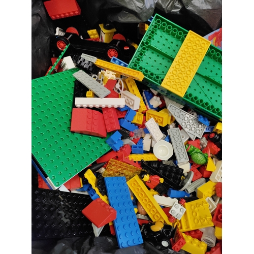 410 - A large job lot of Lego; including bricks, mini figures, vehicles, base boards, signs, star wars leg... 