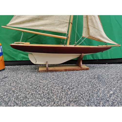 415 - A vintage model wood boat. H 50cm x W 45cm