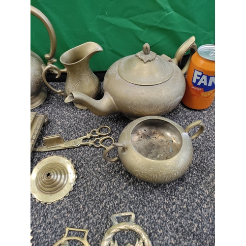 513 - A job lot of brass and a silver plated tray. Collection consists of horse brasses, teapots, an inkwe... 