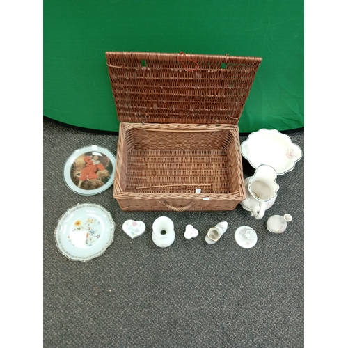 519 - Job lot of floral pattern ceramics in a wicker basket