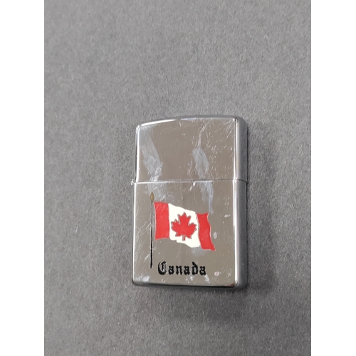 520 - Zippo lighter with Canadian flag. Made in Niagara Falls, Ontario