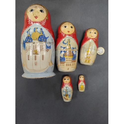 534 - A very old set of russian nesting dolls with russian builds on.