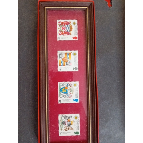 537 - Four framed and boxed sets of stamps including architecture, trains, coats of arms, commemorative.