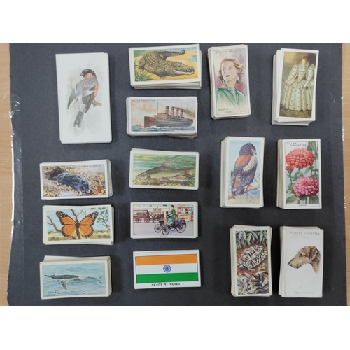 538 - A collection of cigarette cards with a few complete sets. Sets include African wildlife, Film stars,... 