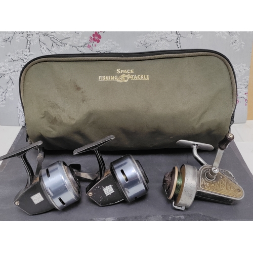 543 - A space fishing tackle reel bag with three reels. One J.W YOUNG & Sons The Ambidex No.2 and 2 ABU 50... 