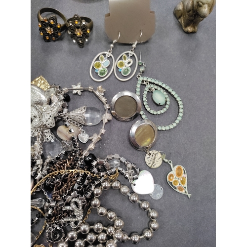 802 - A job lot of white metal jewellery. To include rings, necklaces, pendants, earrings, a small metal d... 