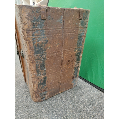 547 - A large brown and black antique metal trunk; Latch stamped E.Bates Wolverhampton lever.