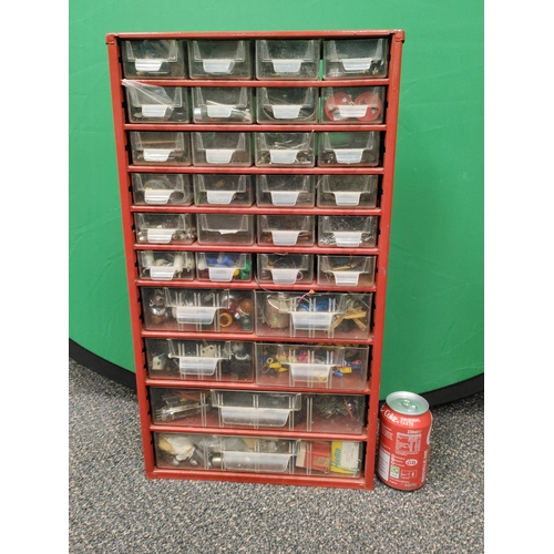 555 - A set of red organising bit drawers, 30 in total;  Contents consist of radio valves, car bulbs to in... 