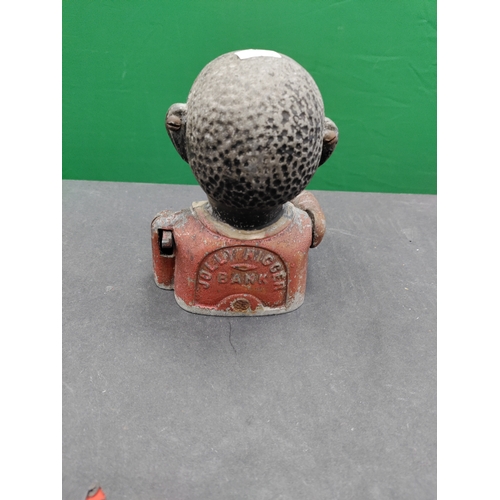 585 - Antique Jolly cast iron money box.