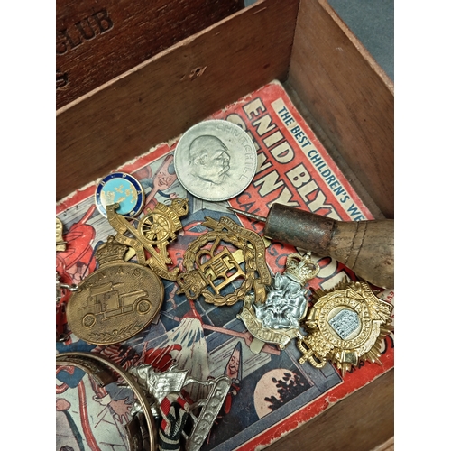 593 - Job lot of military cap badges and various vintage items; Including Churchill coin, Enid Blyton 1937... 